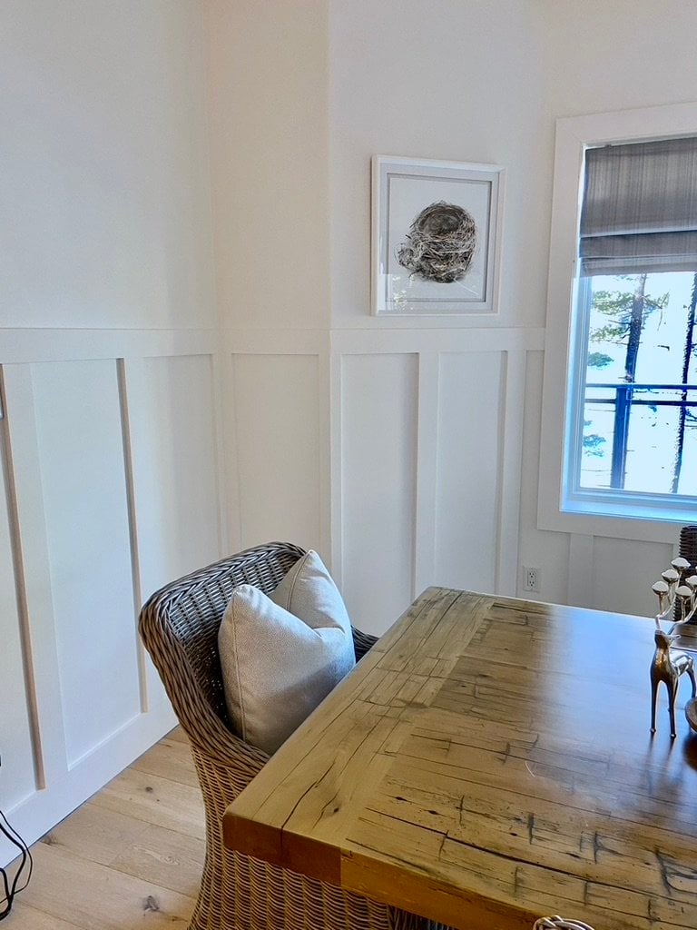 White painted wainscotting with window casing
